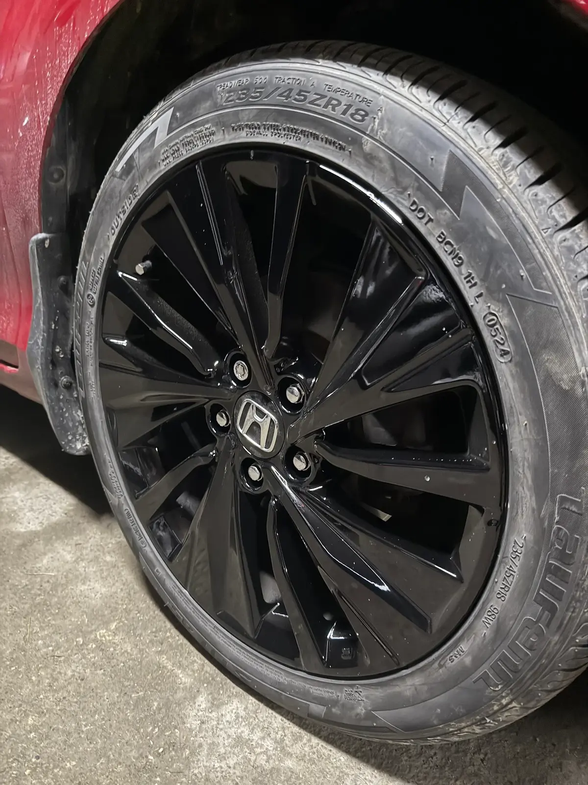 Refinished gloss black alloy wheel after AutoStyle Collision wheel repair